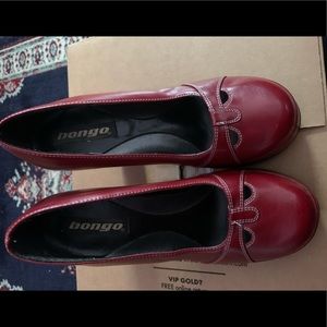 Maroon high heel pumps